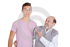 Portrait of grandfather and his teen grandson smiling