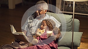 Portrait of grandpa and granddaughter spending time together