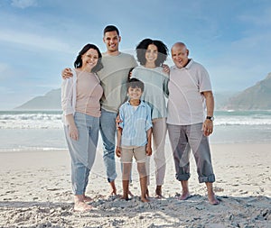 Portrait, grandparents and a family on the beach in nature together for holiday or vacation by the ocean. Love, summer