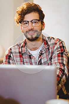 Portrait of graphic designer working on laptop