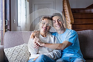 Portrait of grateful teenager man hug smiling middle-aged mother show love and care, thankful happy grown-up son in embrace