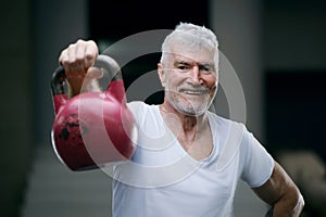 Portrait of a gray haired senior man. Sport and health care concept