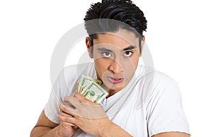 portrait of a greedy man, holding dollar banknotes tightly, isolated on white background