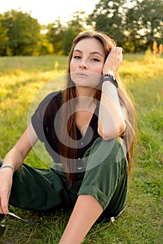 Portrait on green backdrop. Female fashion. Spring meadow. Fashion woman. Rural nature. Summer season. Sunny yellow