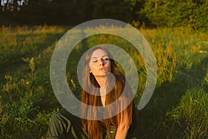 Portrait on green backdrop. Female fashion. Spring meadow. Fashion woman. Rural nature. Summer season. Sunny yellow