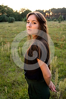 Portrait on green backdrop. Female fashion. Spring meadow. Fashion woman. Rural nature. Summer season. Sunny yellow