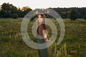 Portrait on green backdrop. Female fashion. Spring meadow. Fashion woman. Rural nature. Summer season. Sunny yellow