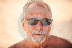 Portrait of Grey Bearded Old Man in Sunglasses