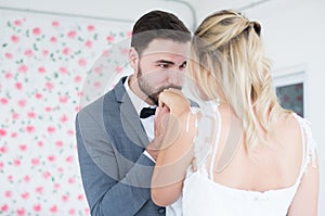Portrait of groom with bride romantic couple is kissing hands,Happy and smiling in engagement day