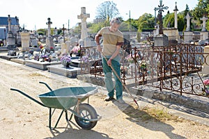 Portrait groundskeeper in cemetery