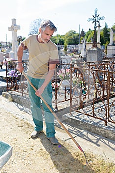 portrait groundskeeper in cemetery