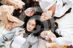 Portrait group of beautiful fashion women meetin in bedroom