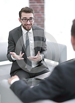 Portrait of a group of business men working together at a meetin