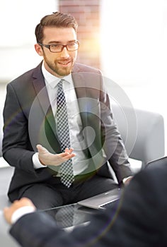 Portrait of a group of business men working together at a meetin