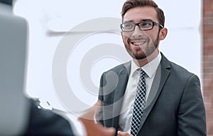 Portrait of a group of business men working together at a meetin