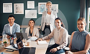 Portrait, group of business people at desk with smile and confidence at meeting for employees in office. Teamwork, about