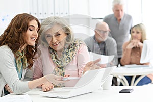 Portrait of group of business people working at office