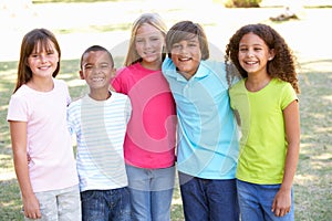 Portrait Of Group Of Children Playing In Park