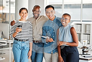 Portrait of a group of diverse cheerful businesspeople spending time in an office together at work. Happy business