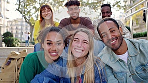 Portrait group of happy young people smiling at camera outdoor