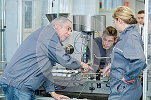 Portrait group machinery apprentice