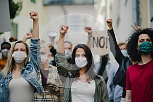 Group of people activists protesting on streets, women march and demonstration concept. photo