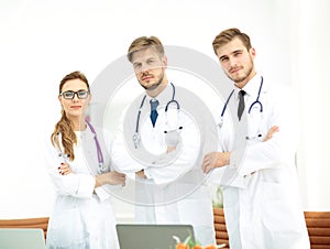 Portrait of group of smiling hospital colleagues standing togeth