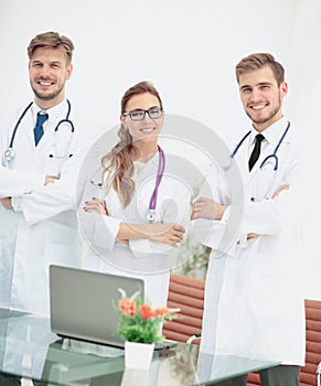 Portrait of group of smiling hospital colleagues standing togeth