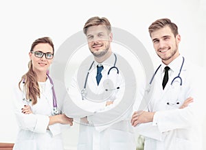 Portrait of group of smiling hospital colleagues standing togeth