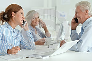 Portrait of group of successful business people in modern office