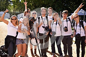 Portrait, group and teamwork with photographers, outdoor and musical festival with joy, cheerful and excited. People