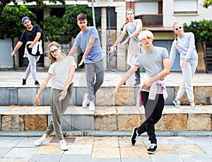 Portrait of group of teenagers at street. Hip hop dancers