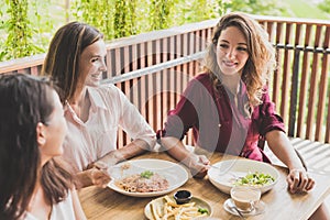 group of three best friend having conversation while lunch toget