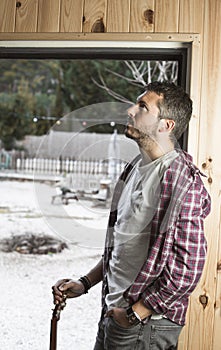 Portrait of a guy with a guitar. Musician guitarist in studio