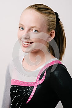 A portrait of a gymnast on a white background.