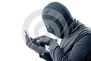 Portrait of a hacker with a stolen mobile phone on a white