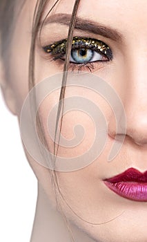 Portrait of half face model with make-up