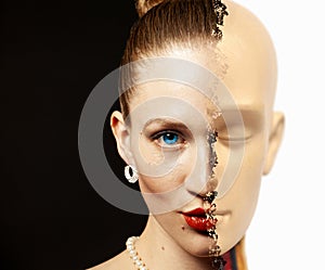 Portrait of half woman`s face transformed is human head anatomy model