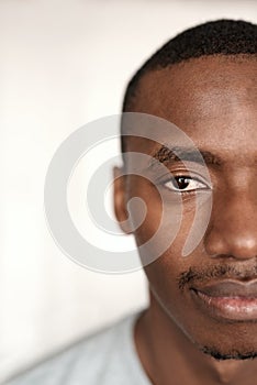 Portrait of a half of a young African man's face