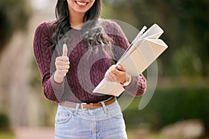 Portrait, hand and girl with thumbs up, student and winning with support, review and promotion for higher education