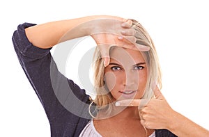 Portrait, hands and finger frame with a woman in studio on a white background framing her face. Beauty, fingers and