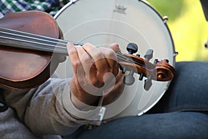 Detail image of violinist playing his instrument photo