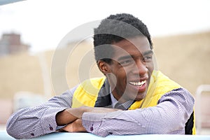 Portrait of a handsome african american man smiling outside