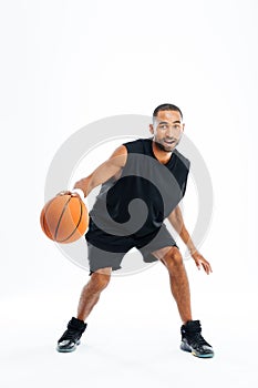 Portrait of a handsome african man playing in basketball