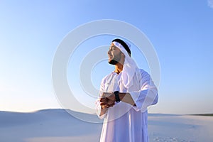Portrait of handsome Arab businessman who experiencing new iWatc