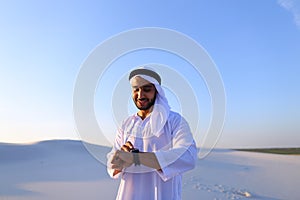 Portrait of handsome Arab businessman who experiencing new iWatc