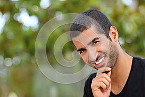 Portrait of a handsome arab man face outdoors photo