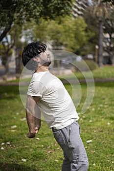 Portrait of handsome attractive mature bearded athletic latin man guy 40s doing stretching exercise