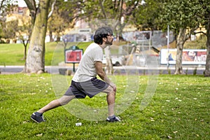 Portrait of handsome attractive mature bearded athletic latin man guy 40s doing stretching exercise