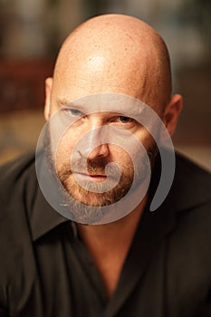 Portrait of a handsome bald man